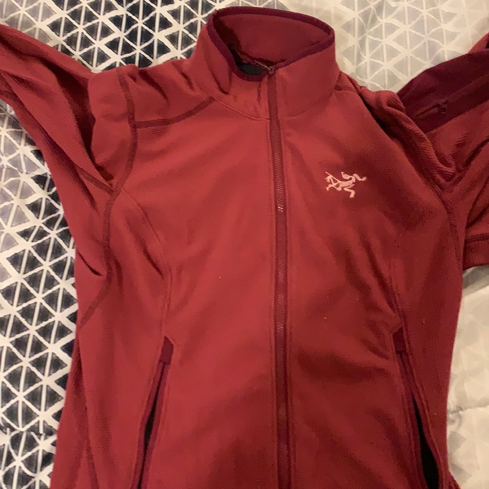 Arcteryx fleece. Maroonish colored.